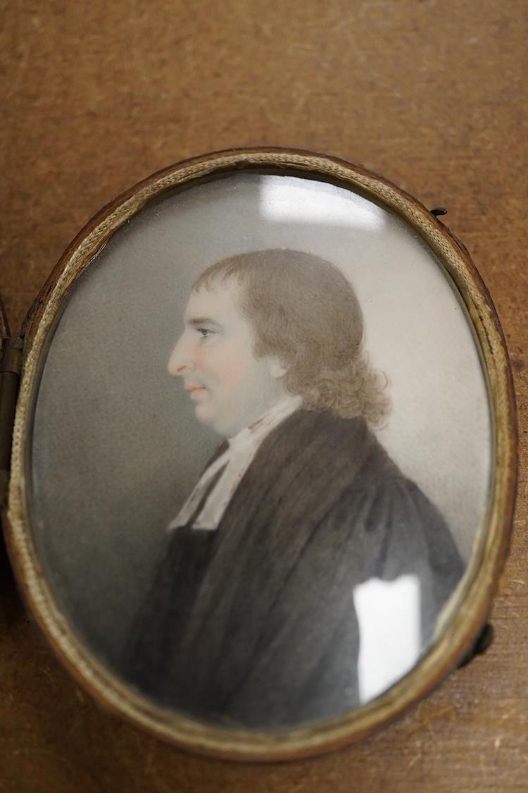 Early 19th century, English School, Portrait miniature of a clergyman, oval watercolour on ivory, housed in a fitted silk and red leather case, 7 x 5.5cm CITES Submission reference, FNKXXK84